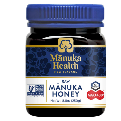 Manuka Health raw Manuka MGO 400+ honey jar with blue lid on a white background