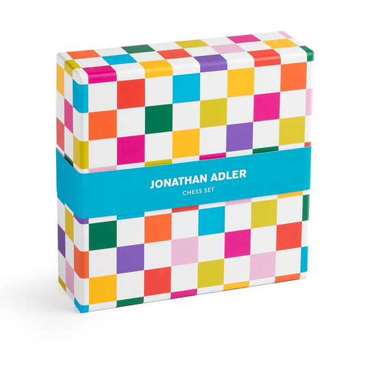 Colorful checkered box of 'Jonathan Adler' branding chess set on a white background