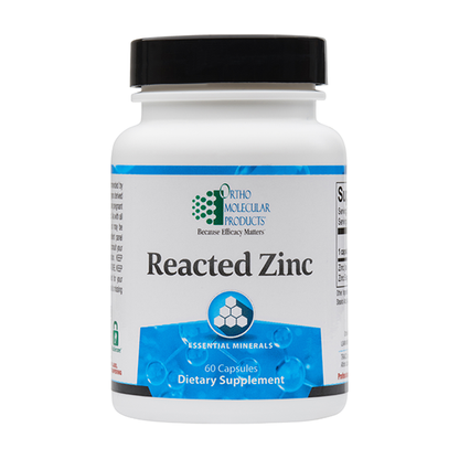 A white plastic bottle of Ortho Molecular Products Reacted Zinc dietary supplement with a black cap, isolated on a white background.